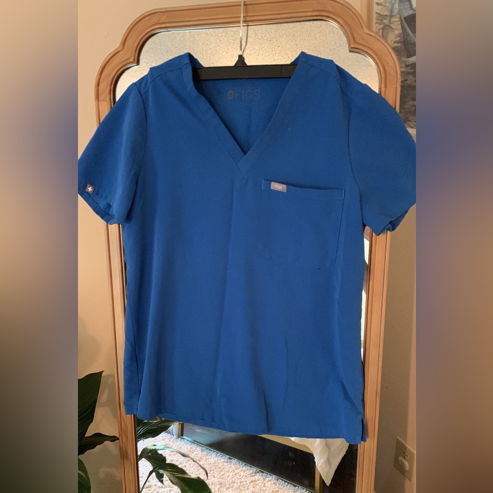 Royal blue FIGS. Classic one pocket scrub tops. $25 per top.